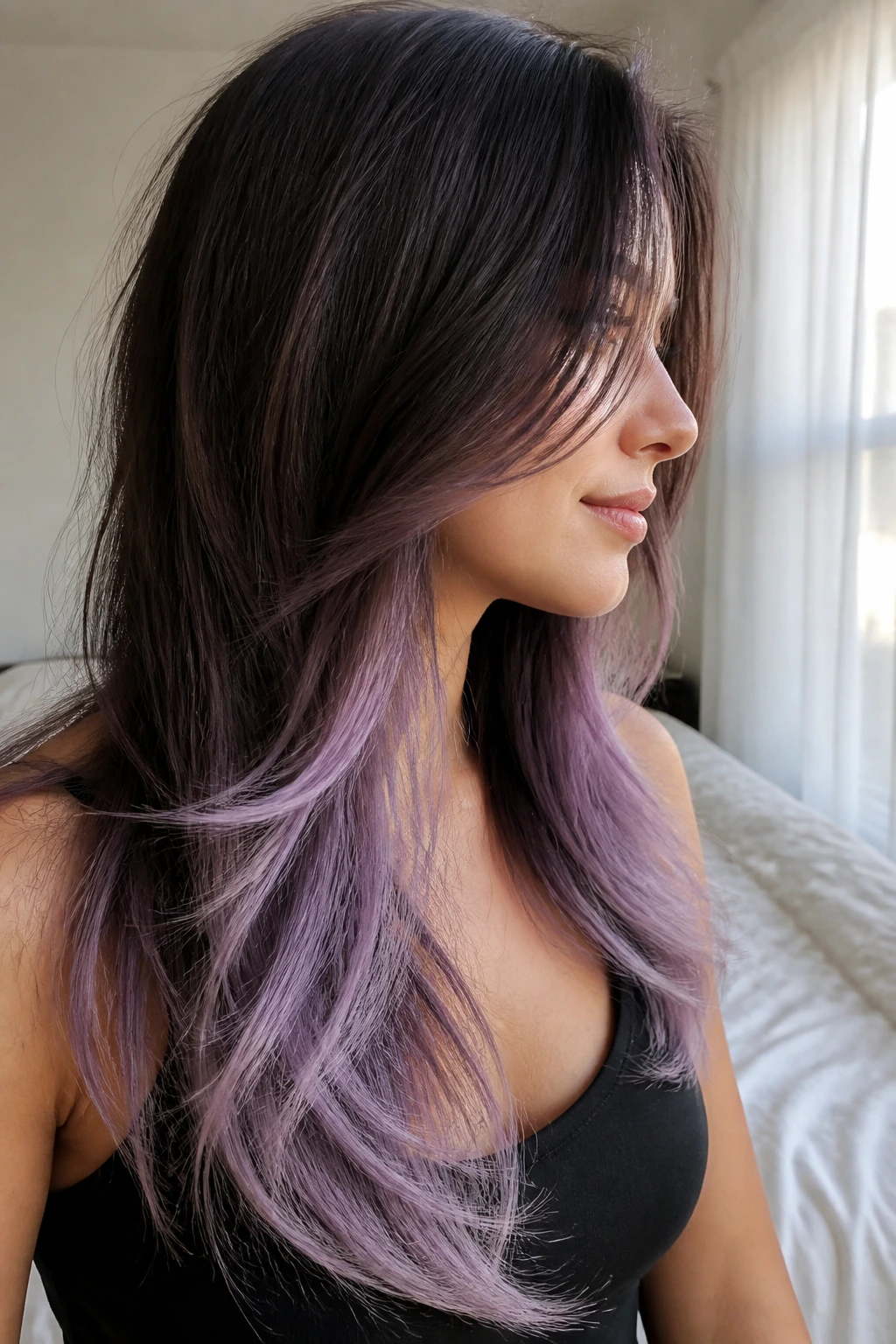 Side-profile of a real woman with lilac frost on long layered hair