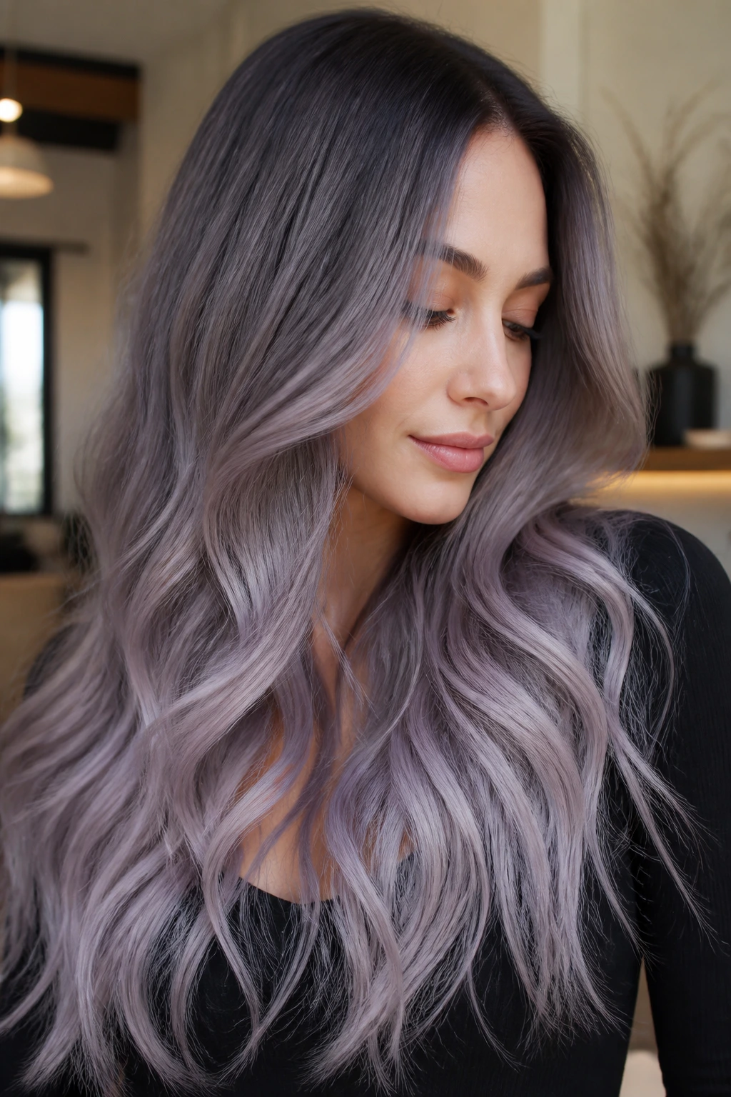 Close-up of long hair with smoky lilac-gray ombre on a real person