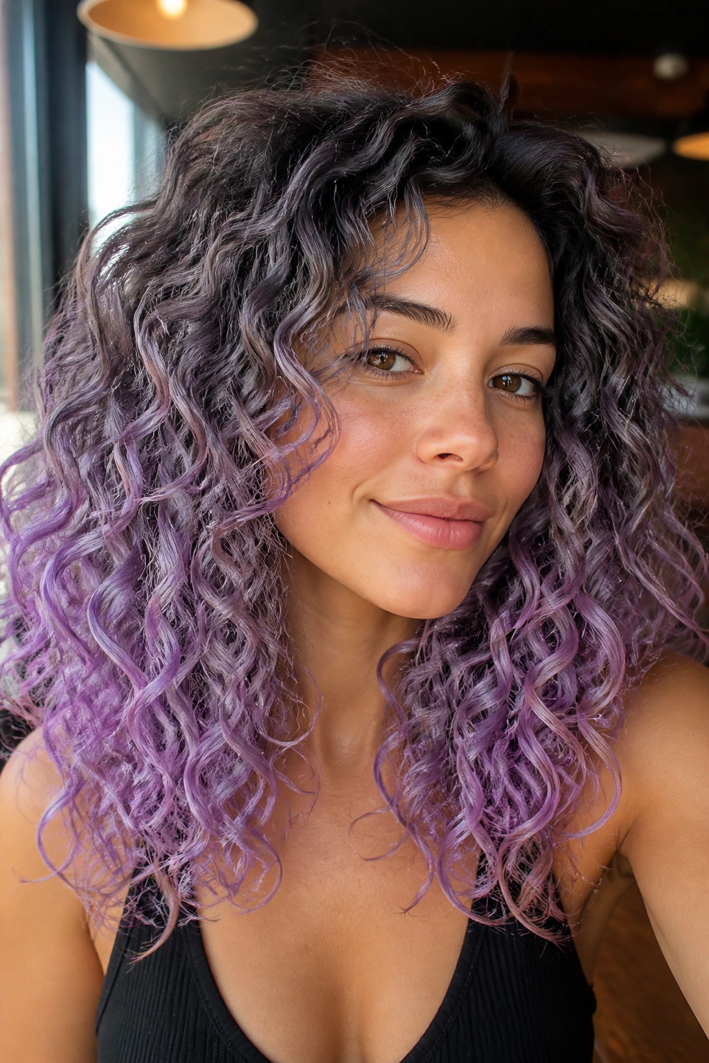 Lilac smoke ombre on curly hair on a real person