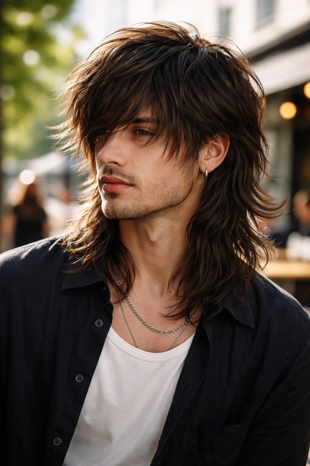 Medium close-up of a person with long layered wolf cut at shoulder length