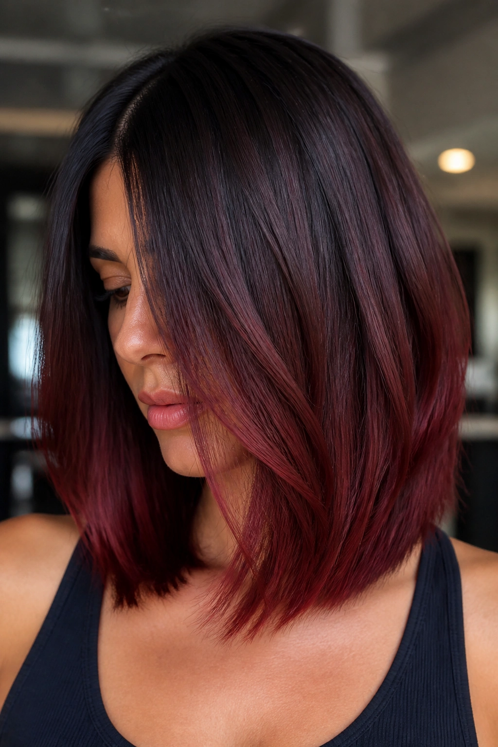 Close-up portrait of brunette with mahogany melt balayage from mid-length to ends