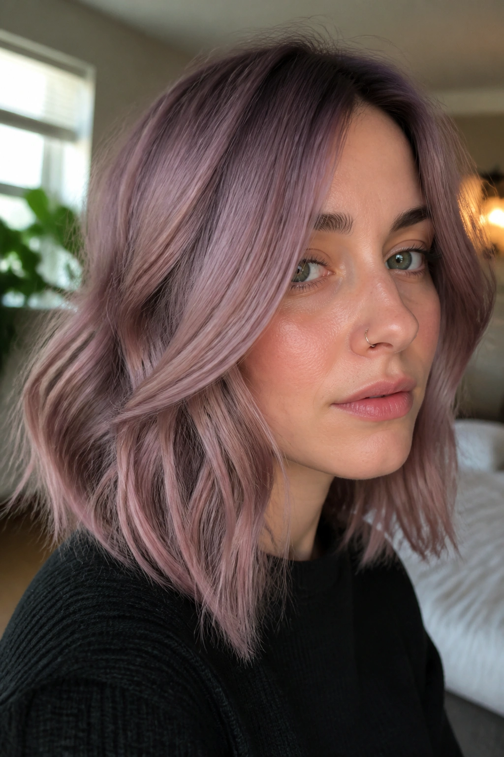 Close-up of shoulder-length mauve quartz hair on cool-toned complexion