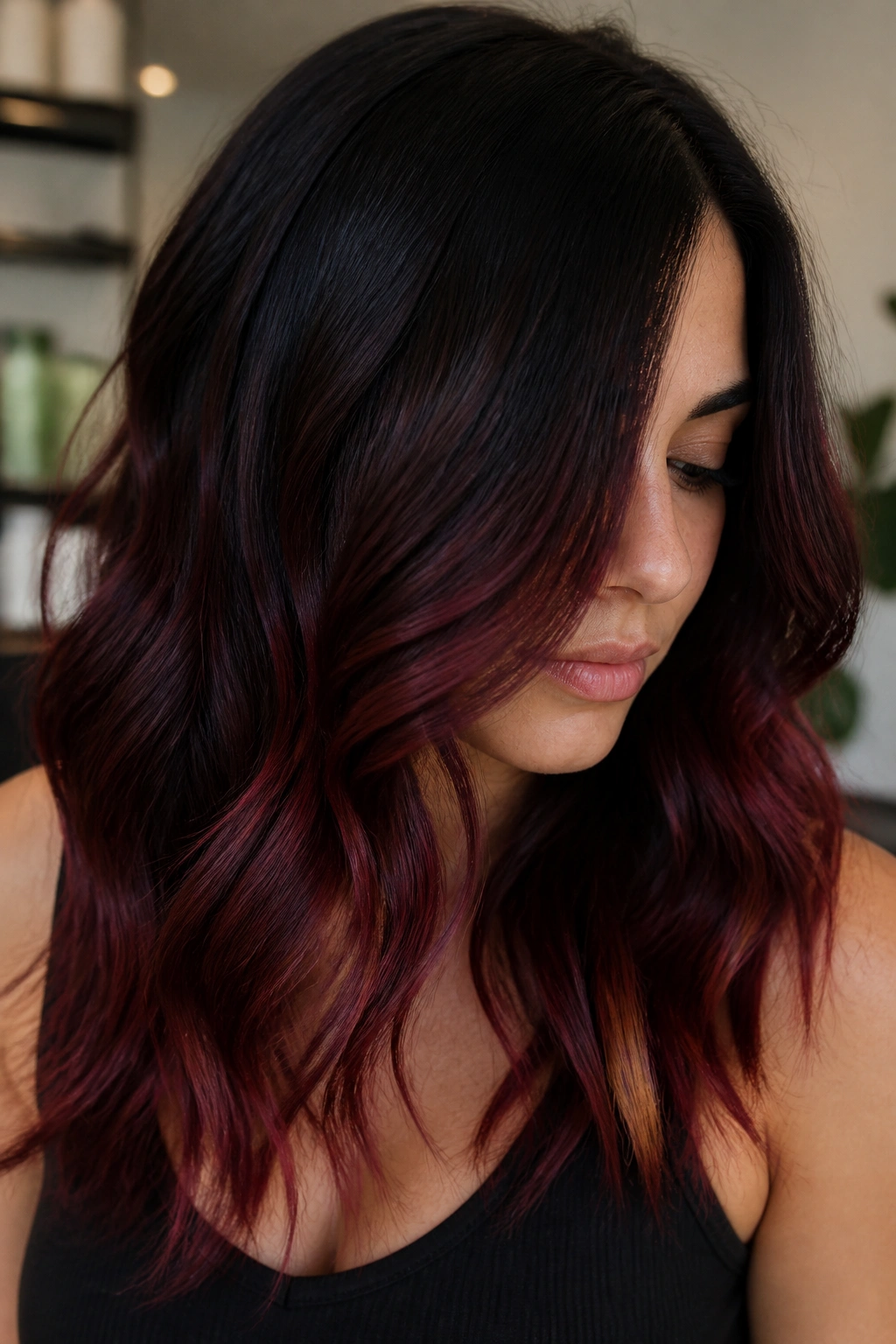 Close-up of merlot balayage on dark brunette base with mid-length to bottom color transition