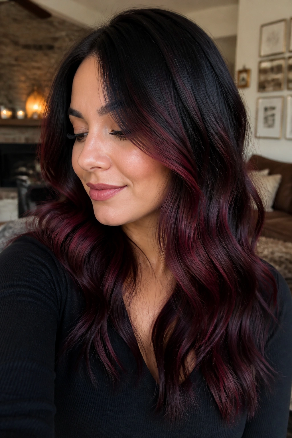Real person with smoky black to merlot melt on wavy hair