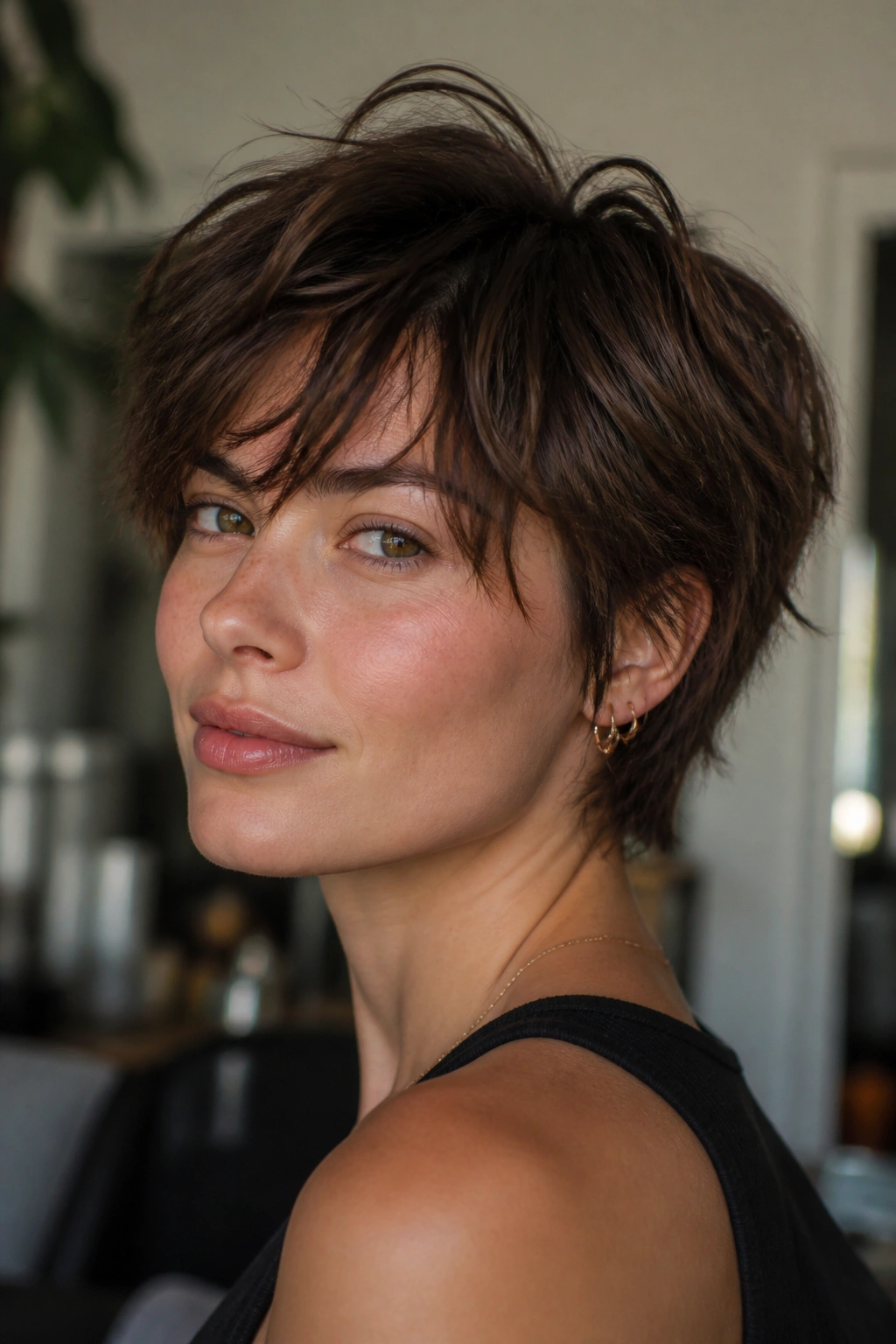 Close-up portrait of a real person with a messy bixie haircut