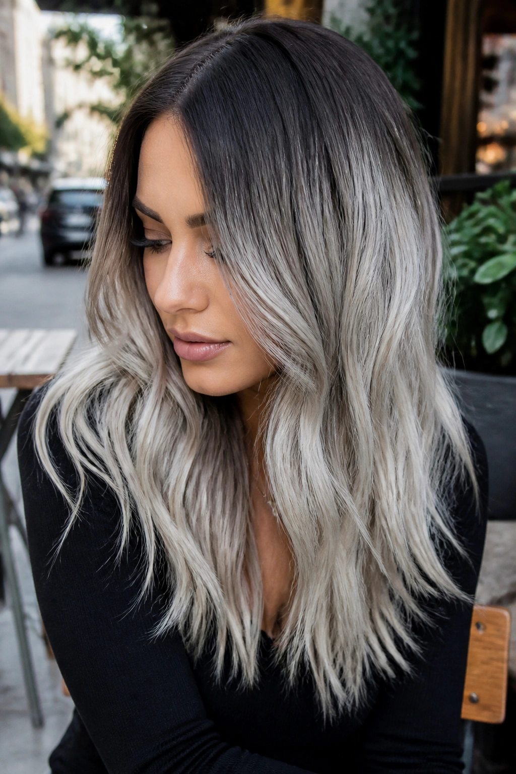 Real person with metallic silver ombré hair from roots to ends.