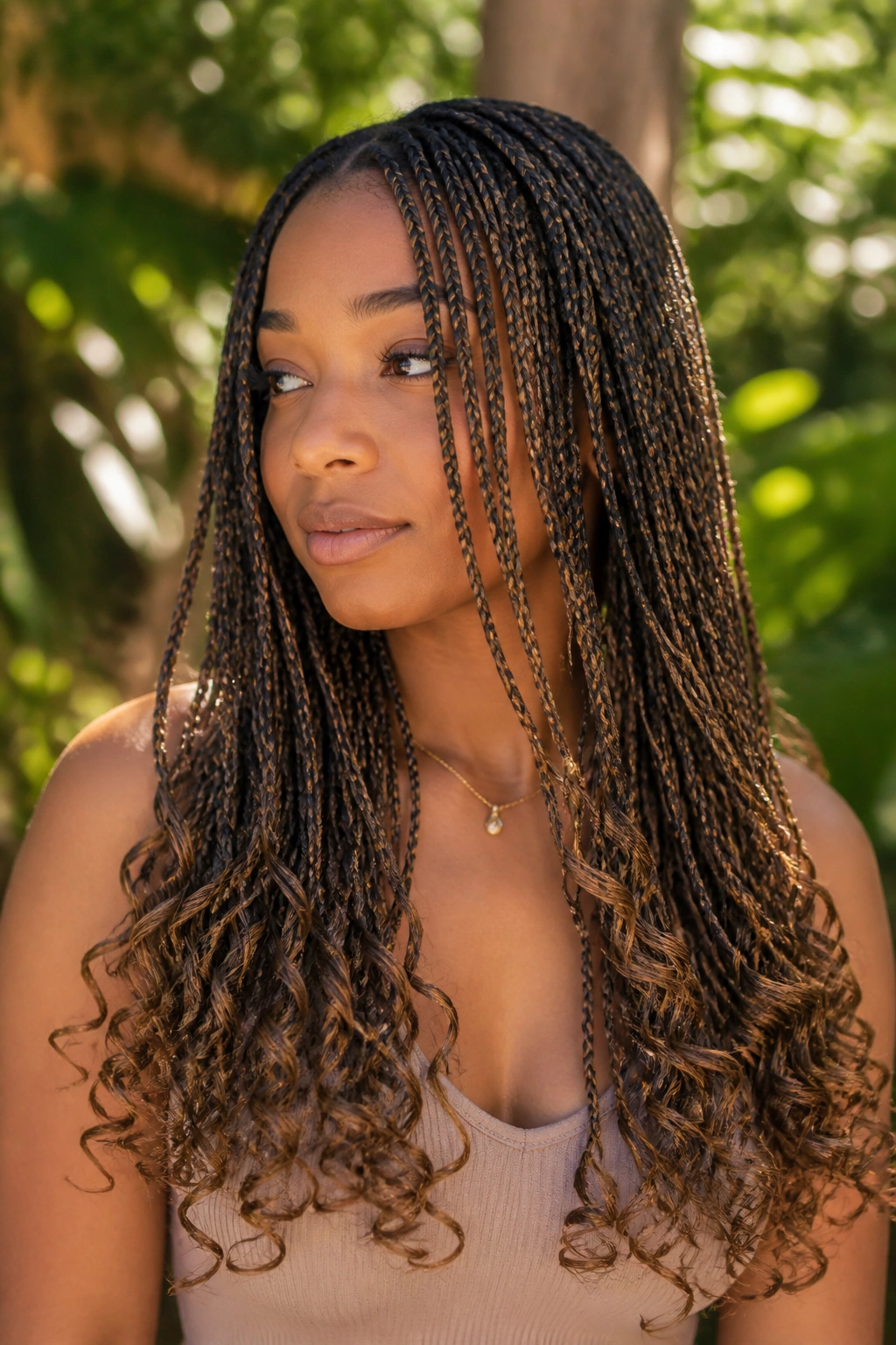 Close-up of micro braids with curly ends on a real person