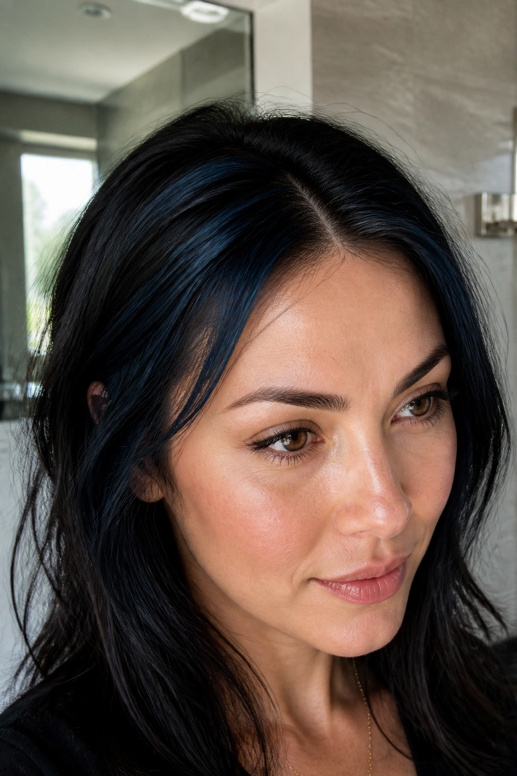 Close-up of hairline with micro-highlights around temples on a real person