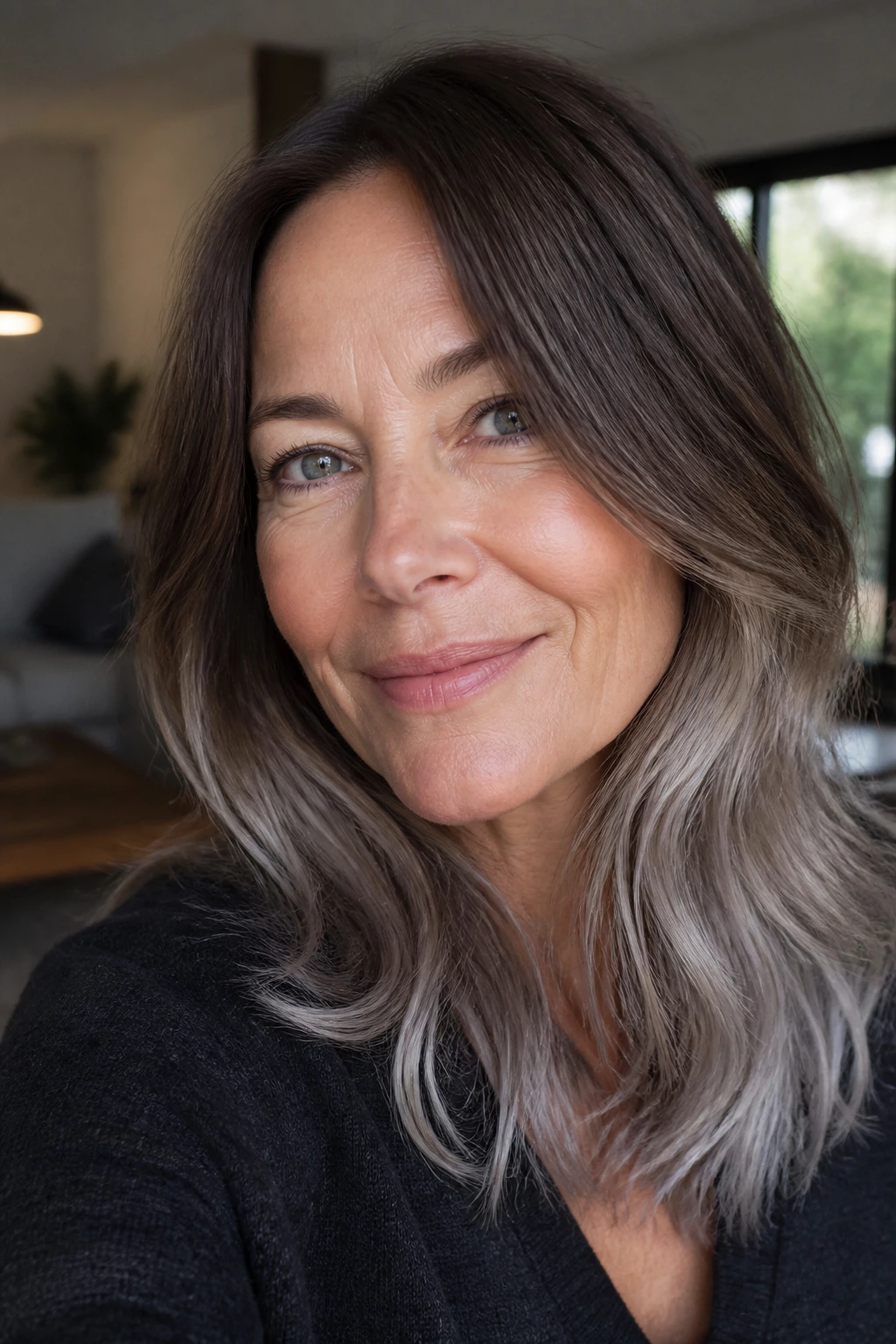 Close-up portrait of a real woman with mink brown hair and silver ends