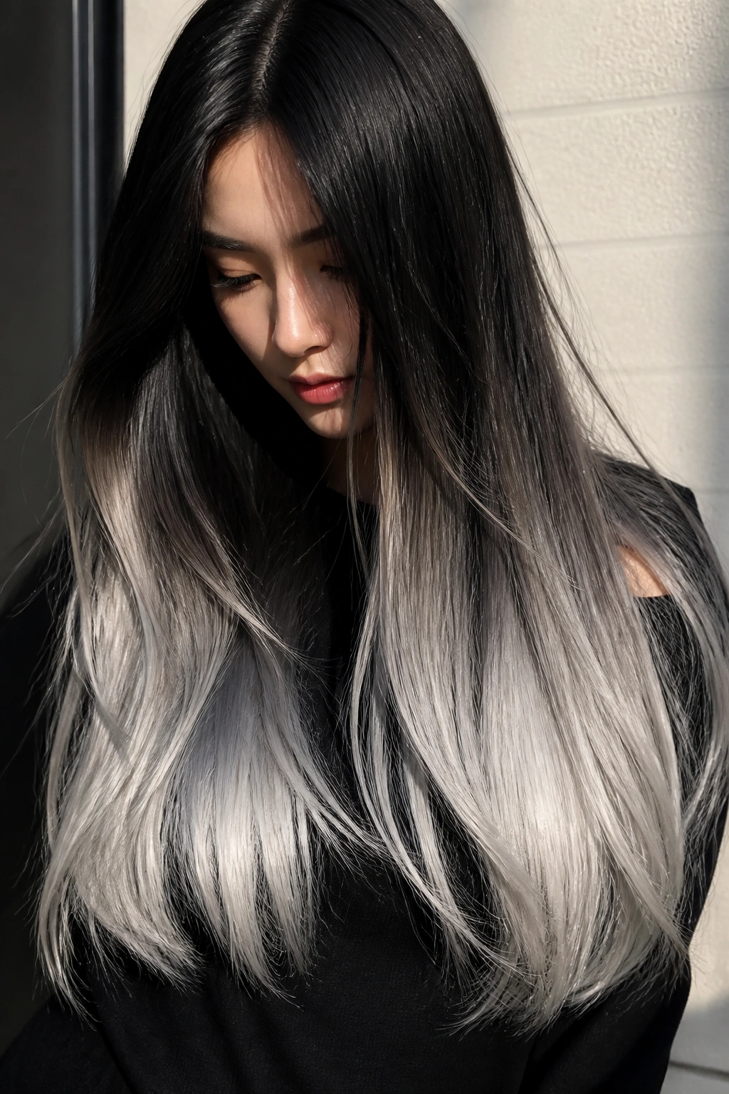 Close-up of woman with mirror-sheen silver tips on extra-long hair