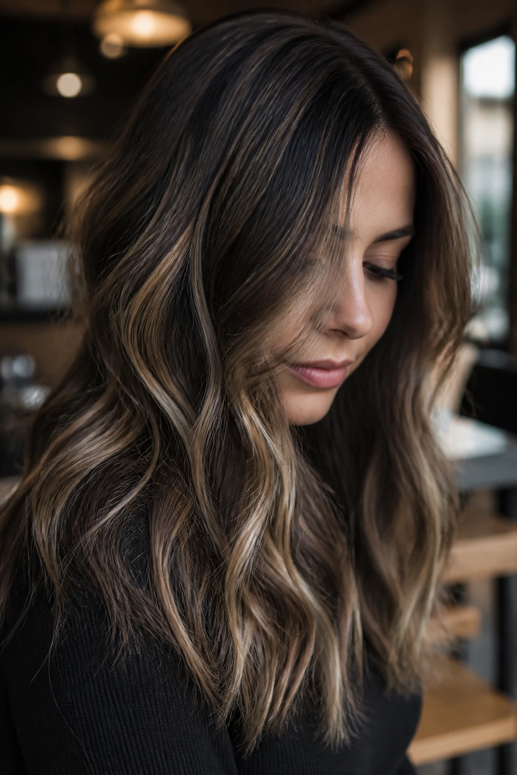 Close-up portrait of a real woman with mocha smoke balayage and ash highlights.