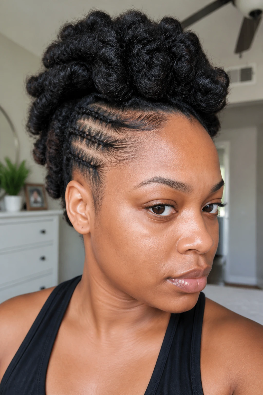 Close-up of a real Black woman with crochet mohawk showing an overpacked style.