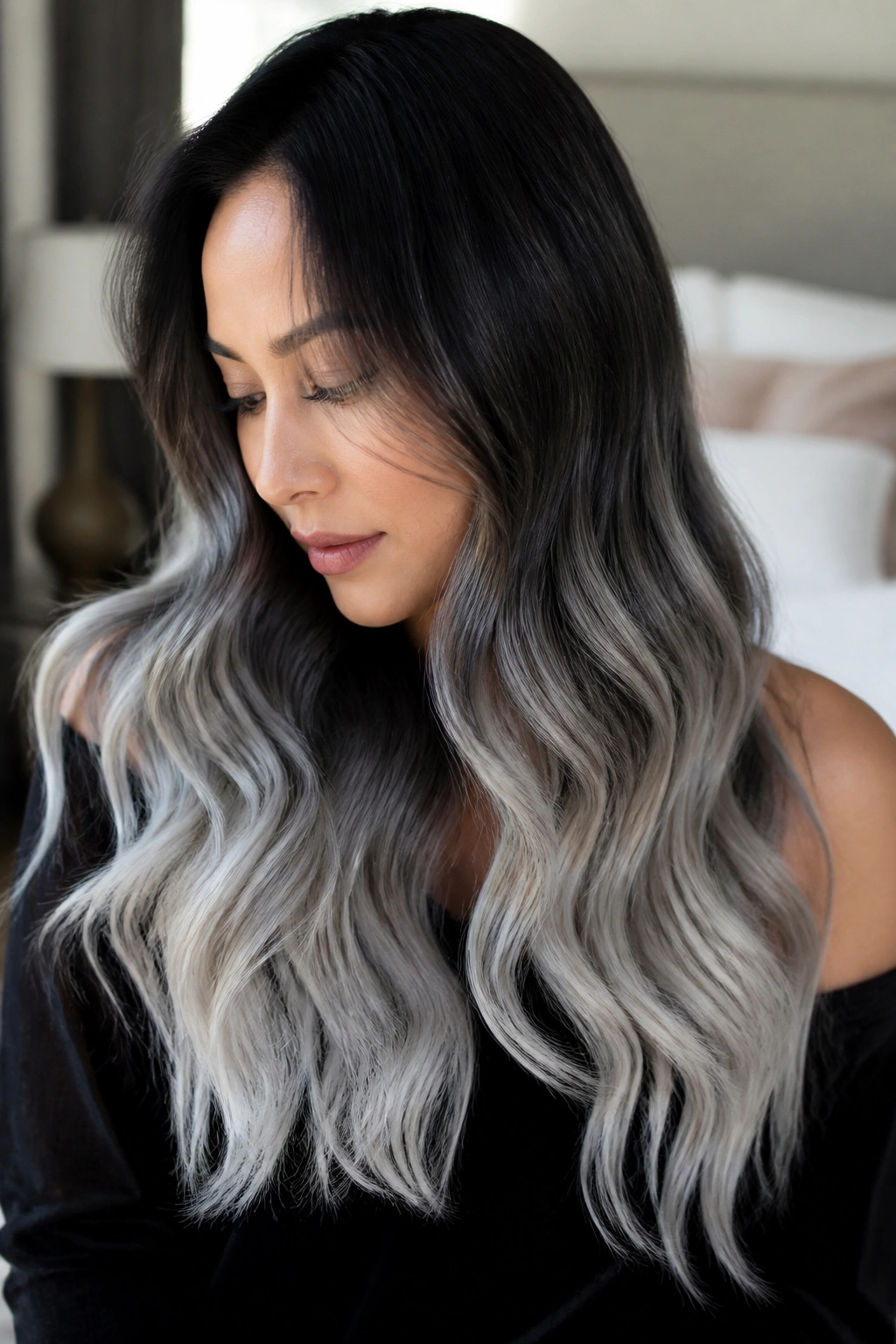 Close-up portrait of brunette hair transitioning from black-brown roots to moonlight silver ombre
