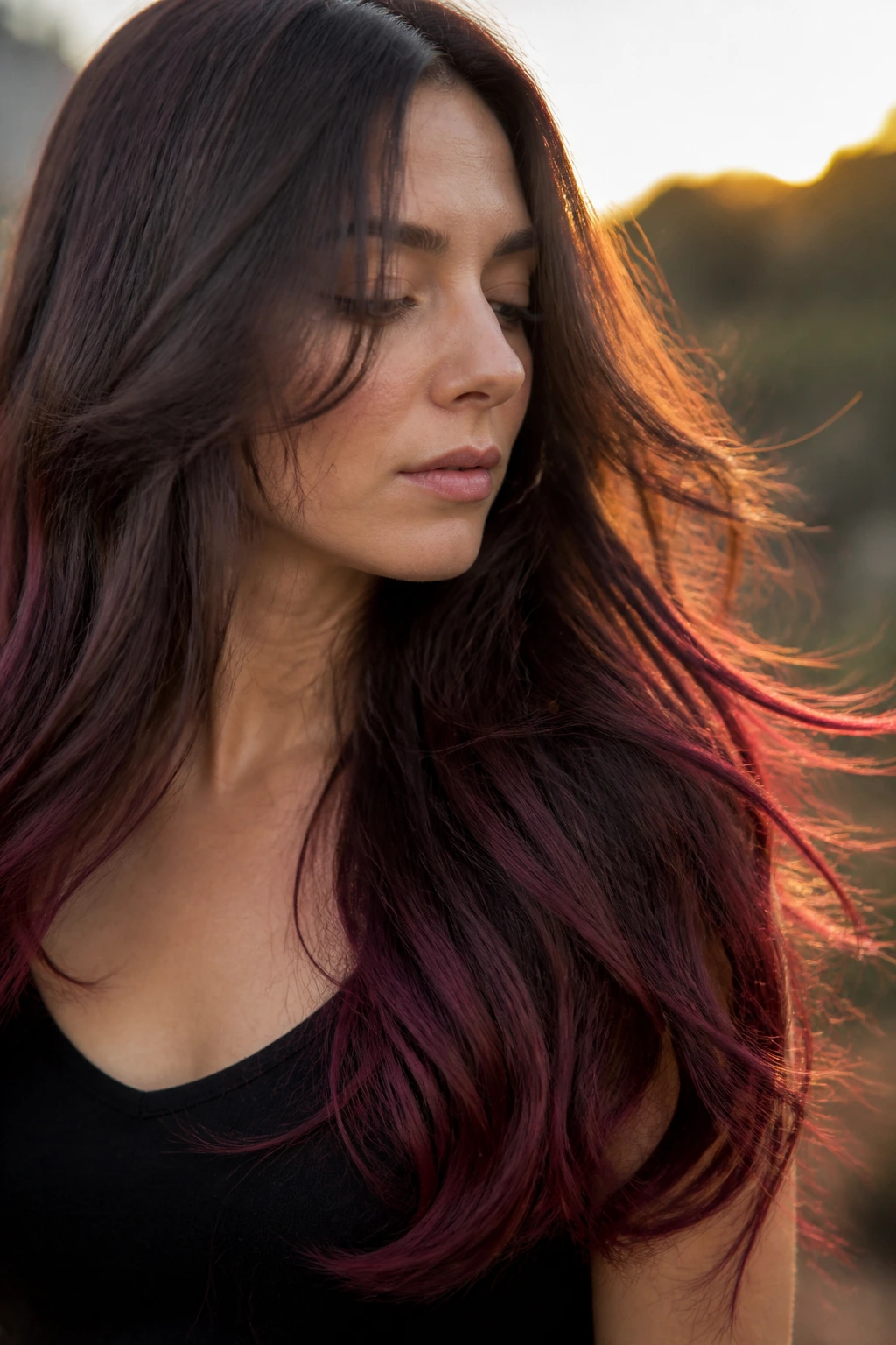 Close-up portrait of a real woman with mulberry brown ends on long hair
