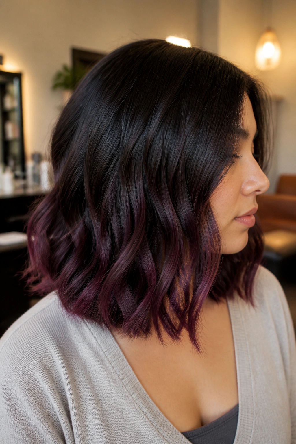 Close-up of a real person with mulberry-tipped shoulder-length hair.
