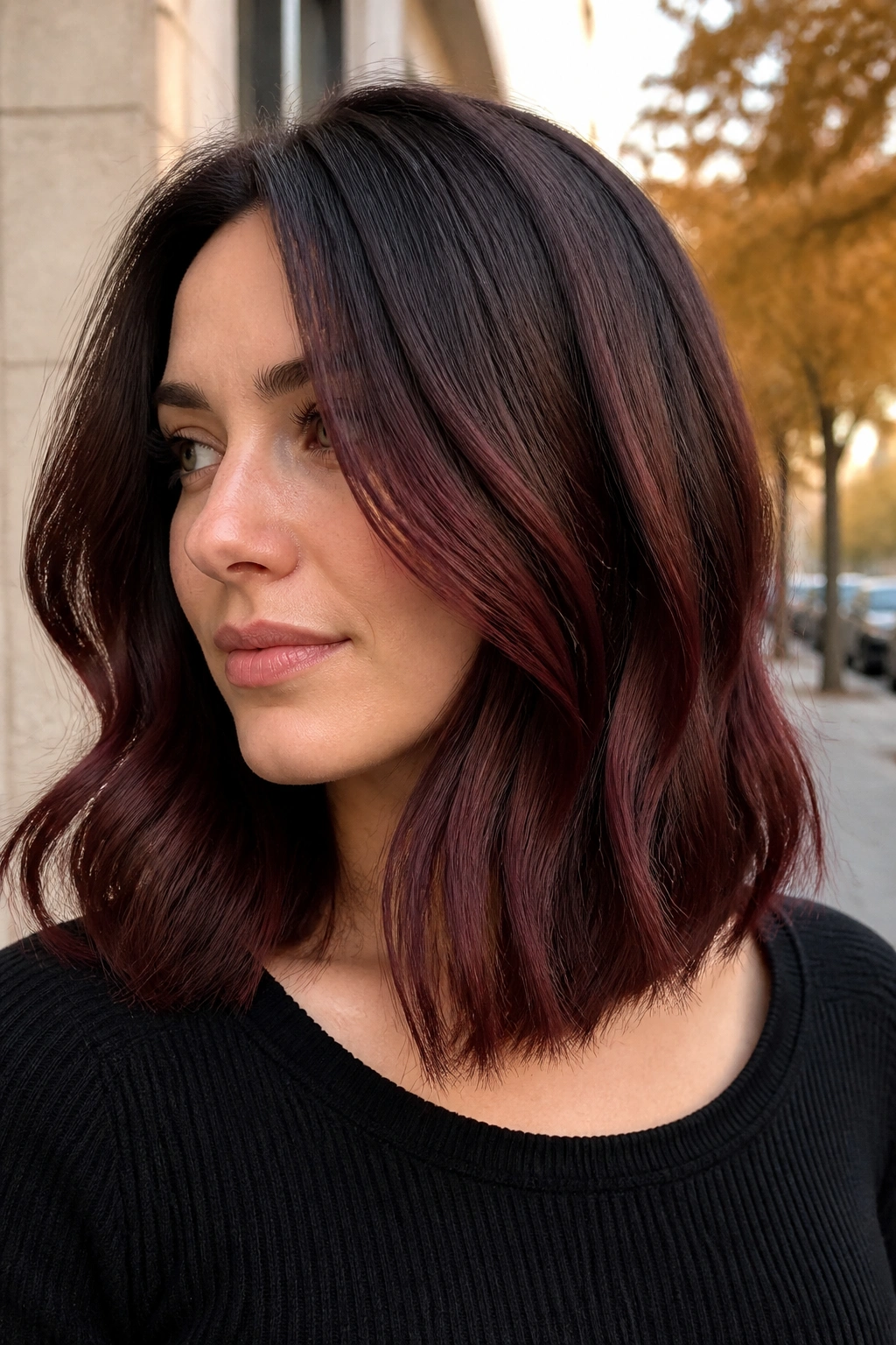 Close-up of mulled wine lob on a real woman with wine-red reflections