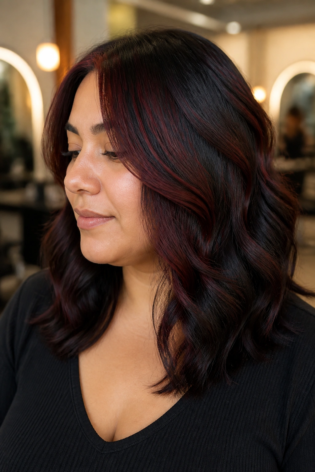 Close-up portrait of a woman with mulled-wine lowlights and black ends