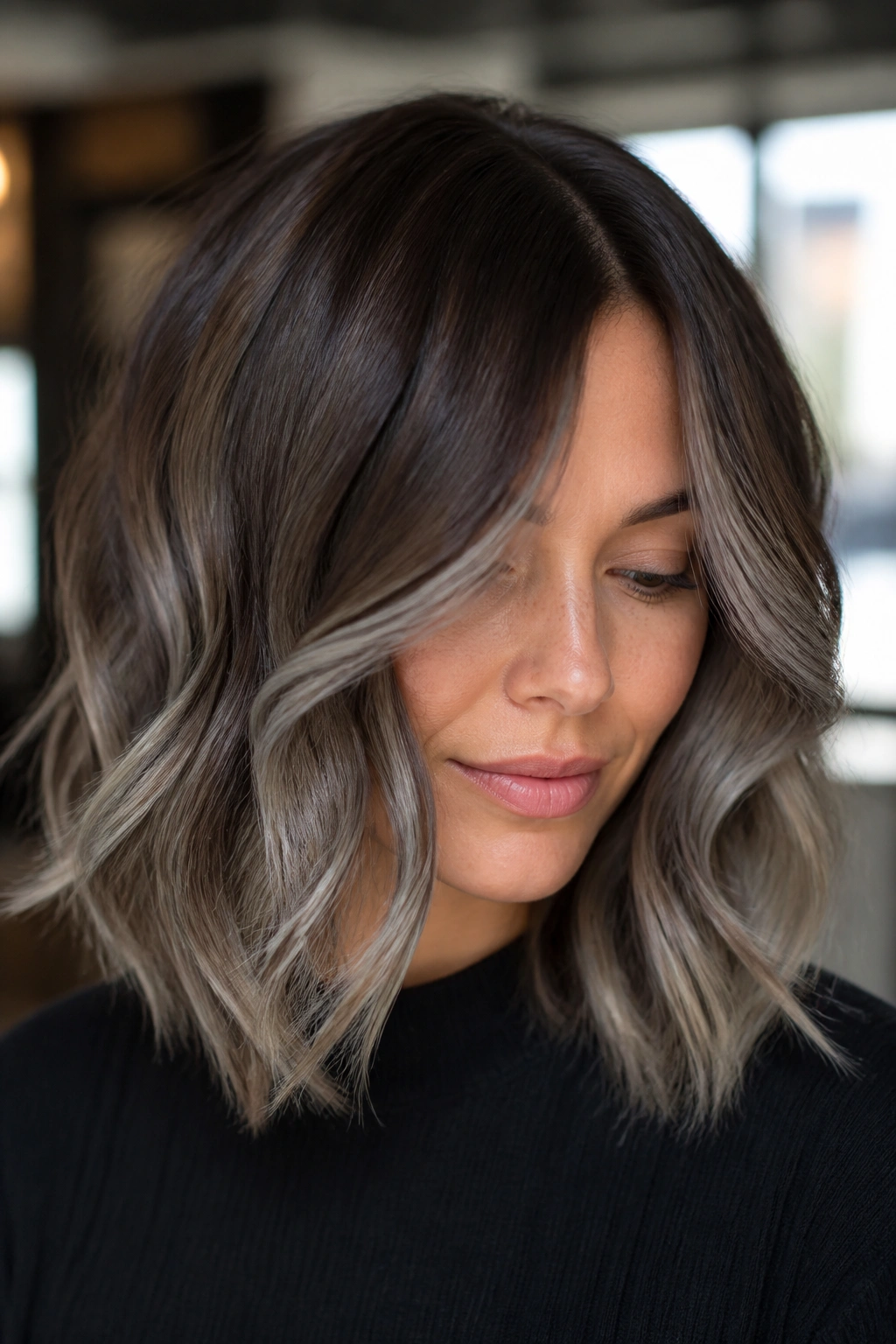 Close-up portrait of a real woman with mushroom brunette smoky midlength balayage