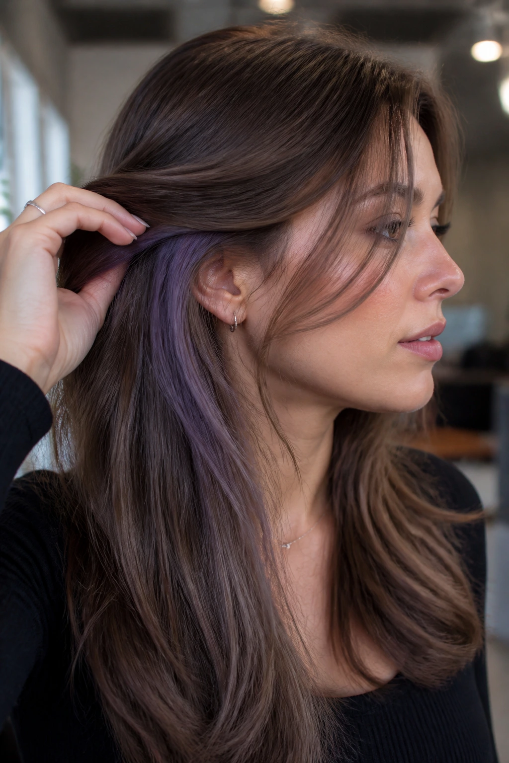 Close-up of a real person with mushroom brunette and violet peekaboo behind ears