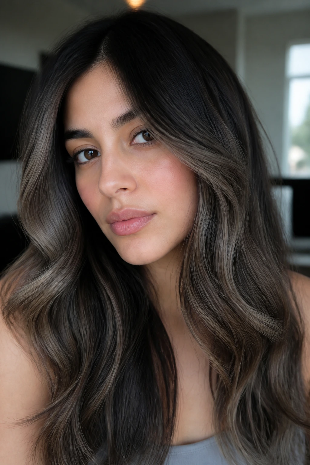 Close-up of mushroom brown veil highlights on hair framing the face