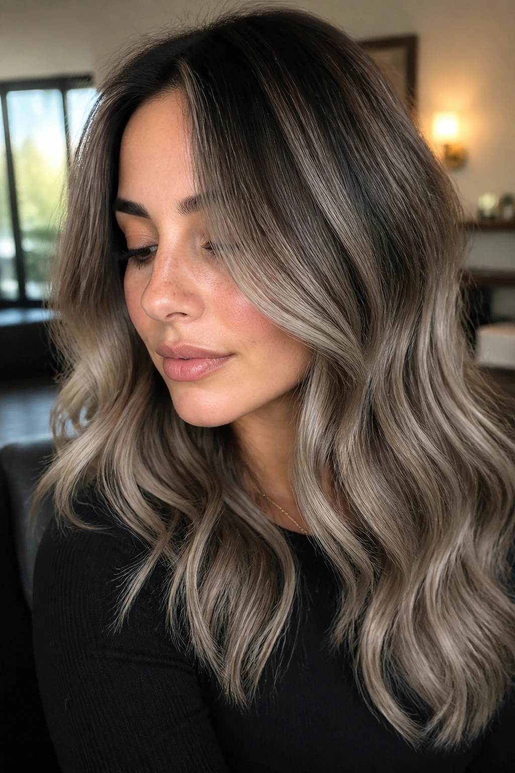 Close-up of real person with muted ash balayage