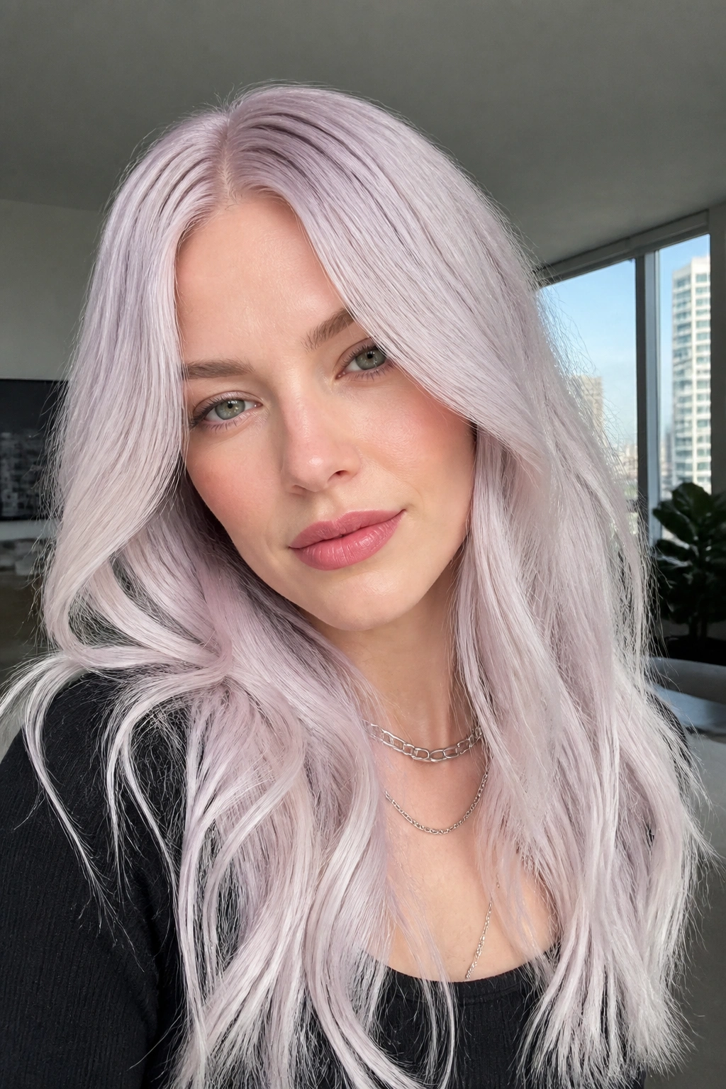 Close-up portrait of a real woman with orchid-glazed white blonde hair.