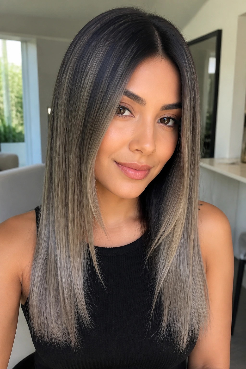 Portrait of a real person with straight hair showing pearl grey balayage