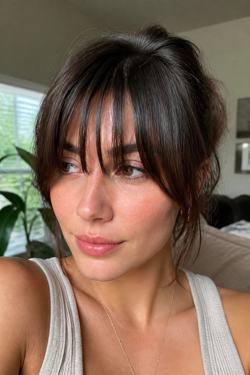 Real person with piecey thick bangs showing separated sections