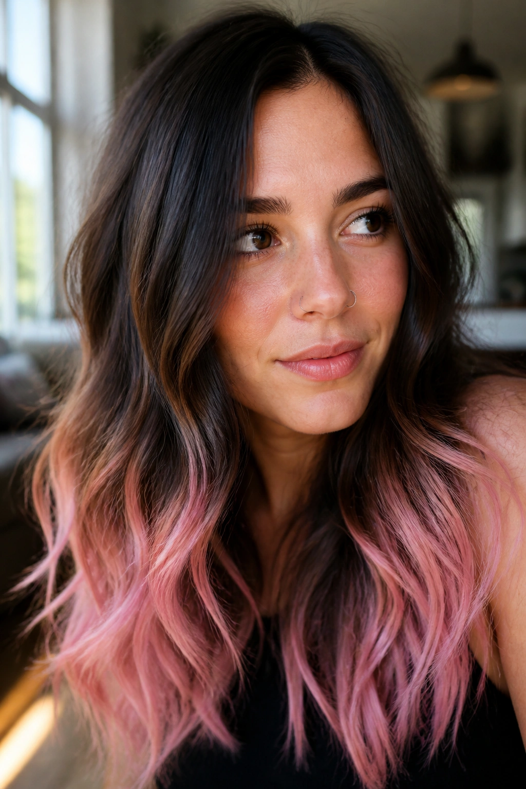 Close-up of brunette with pastel pink dip-dyed ends