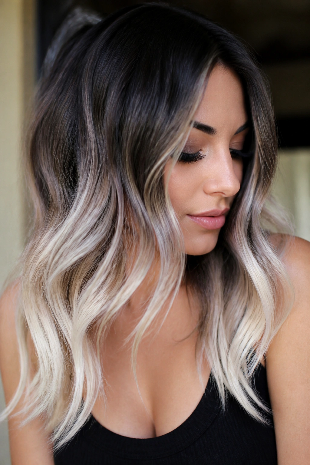 Close-up of brunette-to-platinum ends on a real woman's hair.