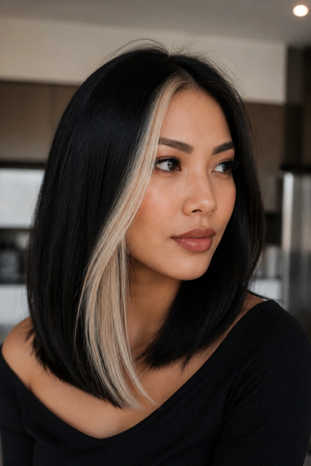 Close-up of black hair with a platinum panel on one side