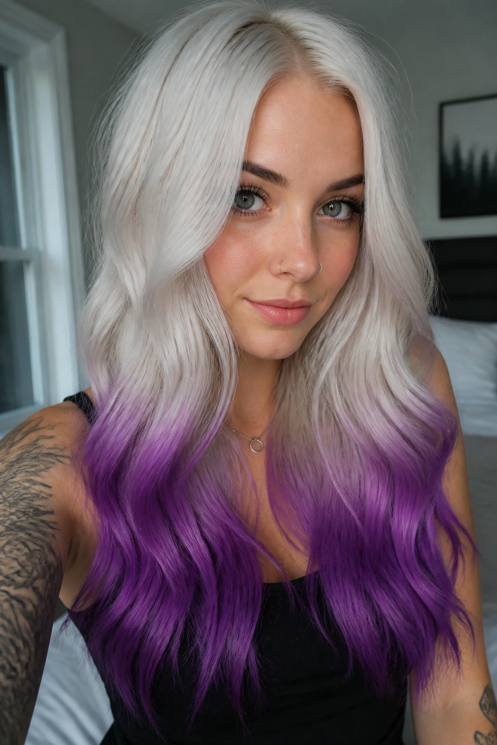 Close-up portrait of a real woman with icy platinum roots and purple dip-dye ends in long hair