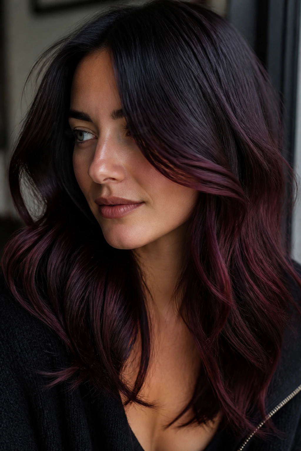 Close-up of real woman with plum-black melt hair color