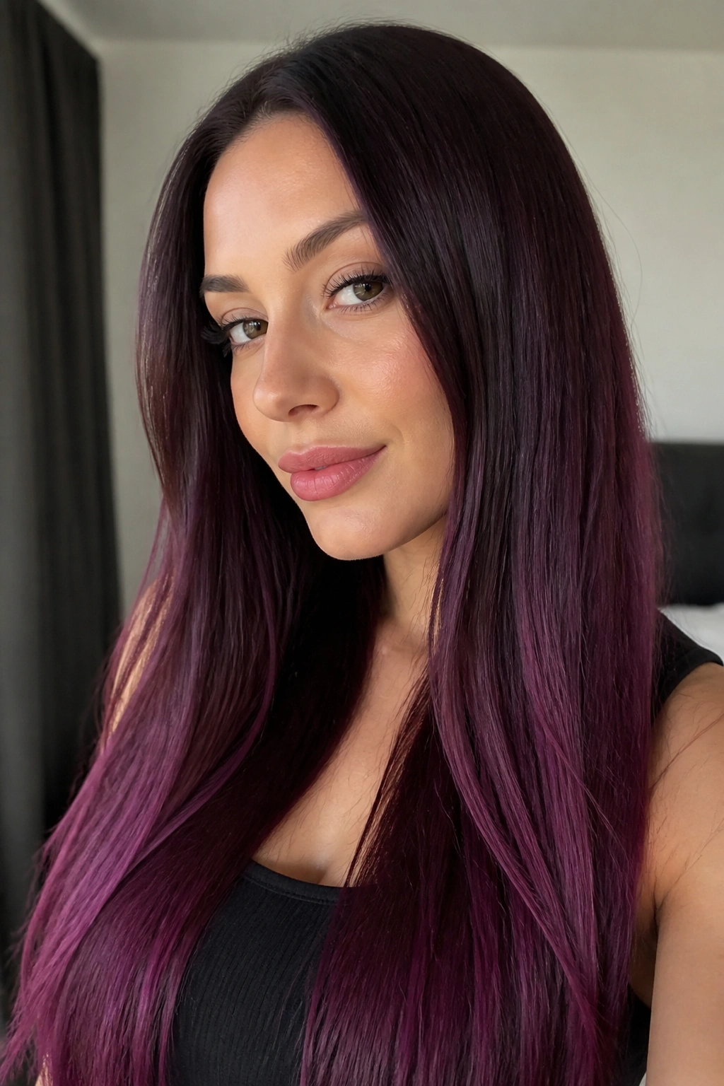 Close-up of a real woman with plum burgundy straight long hair