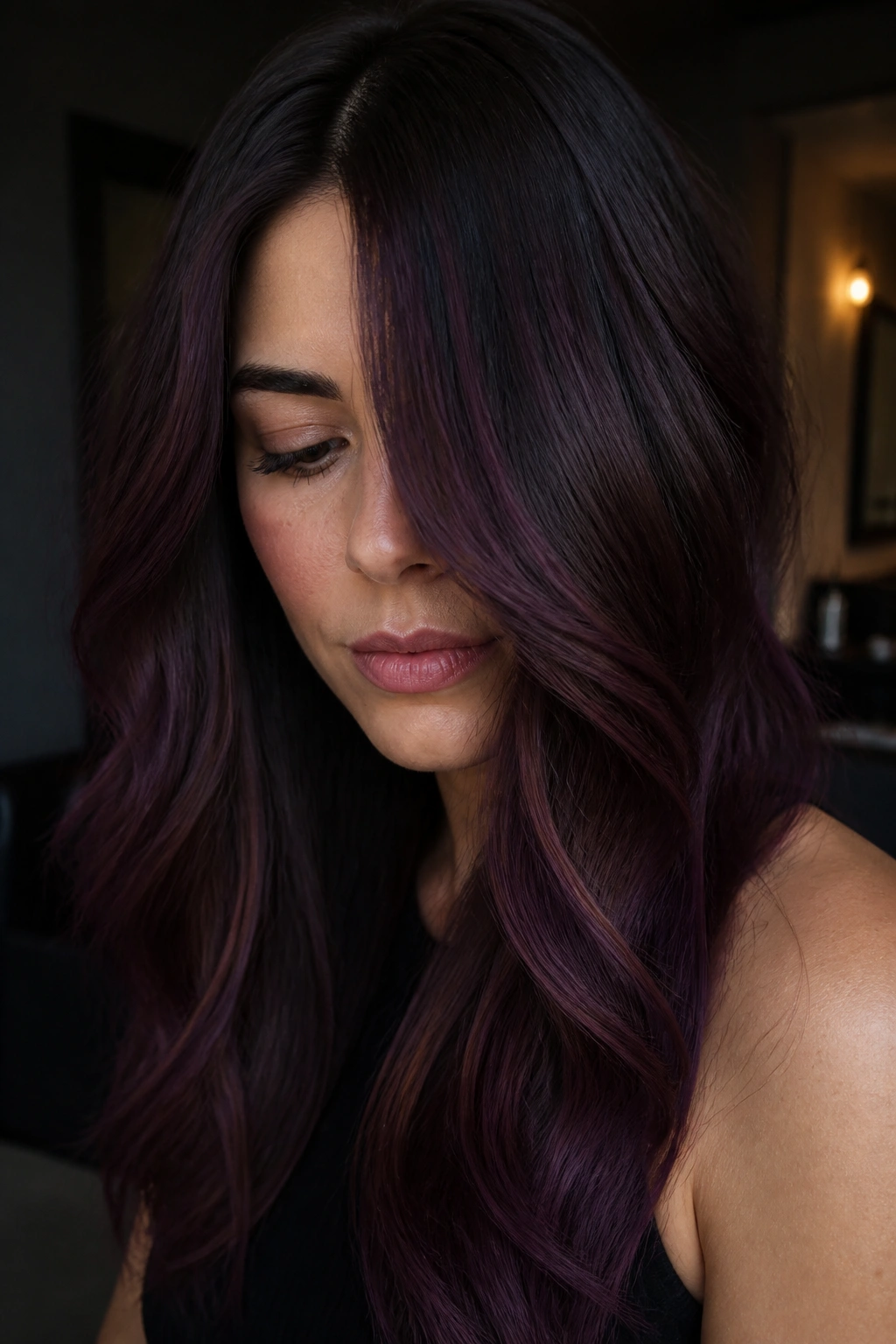 Close-up of a real woman with plum cocoa melt hair color