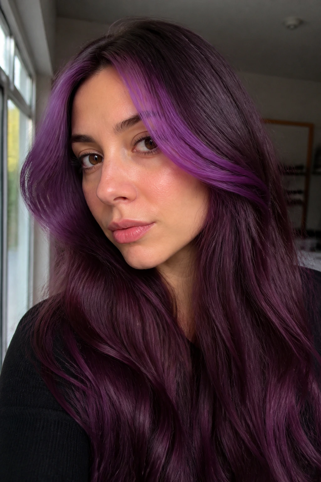 Real woman with plum ombre and lighter purple money piece framing the face