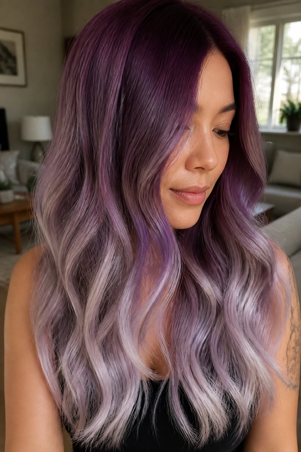 Close-up portrait of a real woman with plum to silver lilac ombre hair
