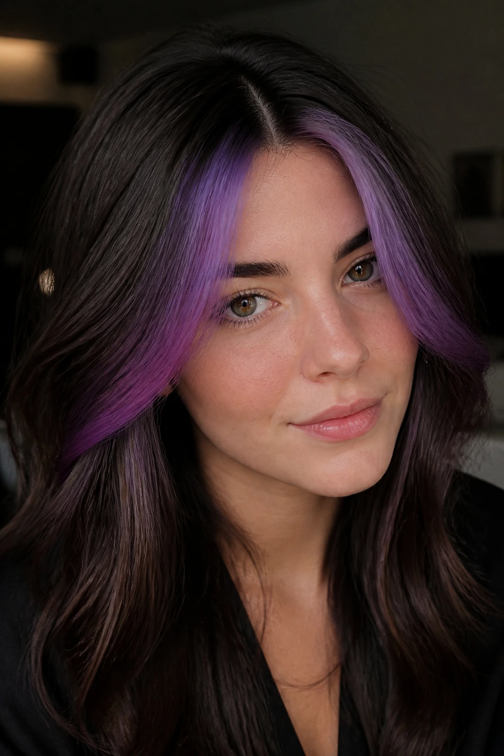 Close-up of a person with a purple money piece and shadow root