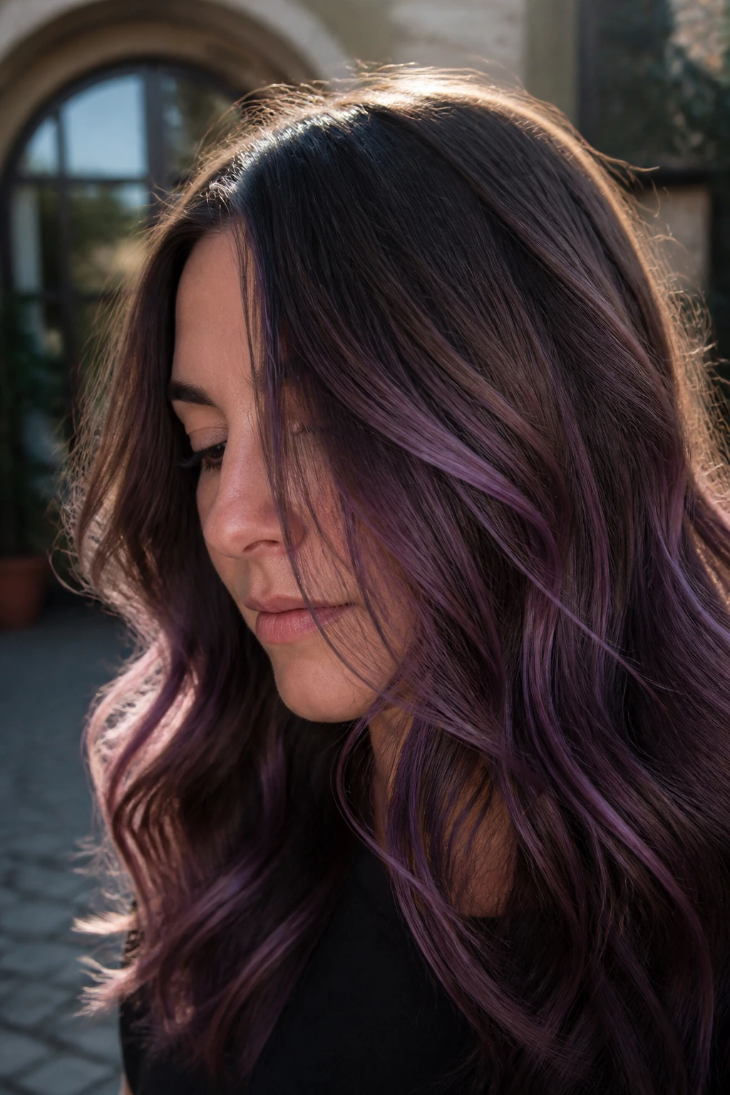 Close-up of brown hair with soft purple ribbons for a smoky, muted look.