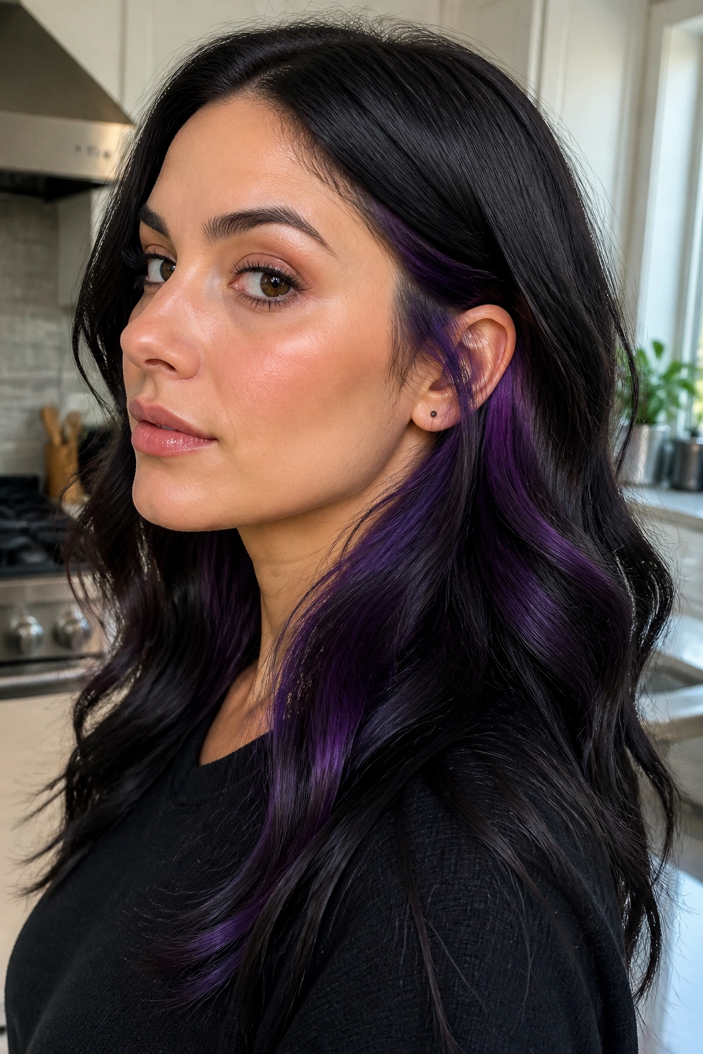 Real woman with jet black hair and hidden purple underlayer.