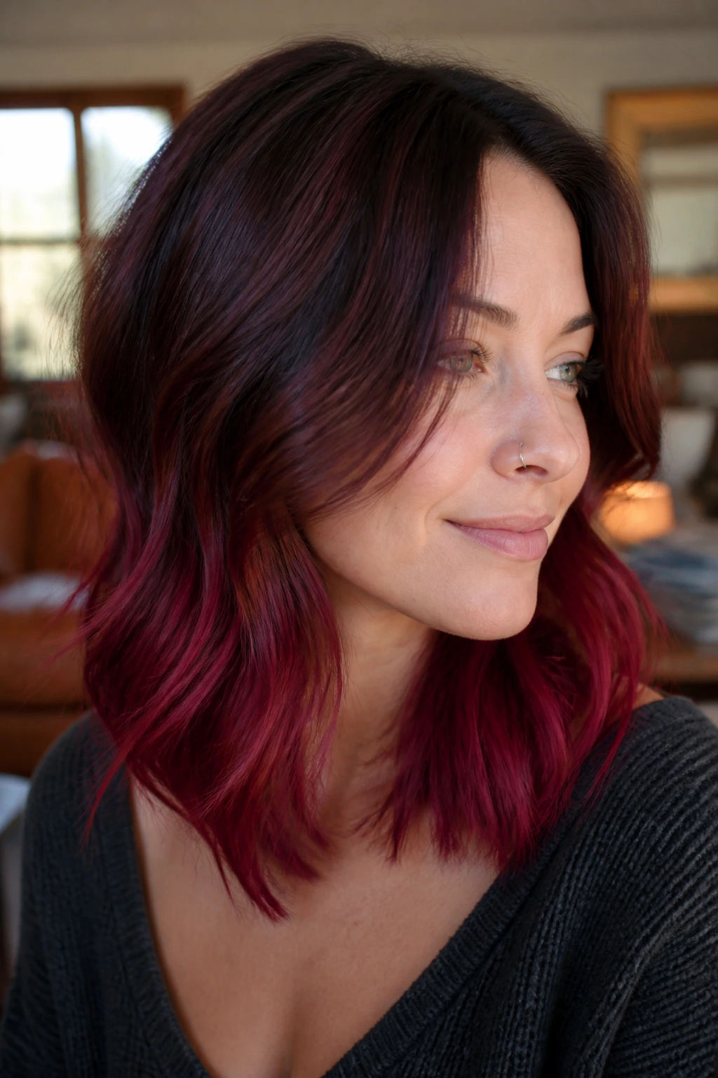 Close-up portrait of a real woman with Raspberry Mahogany Ends highlighted at the hair tips