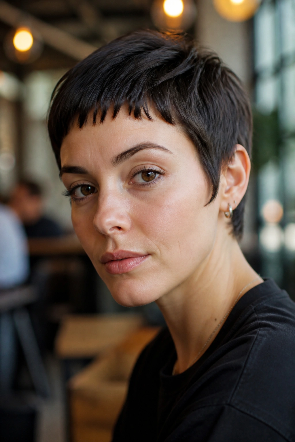 Real person with razor-cut crop and micro fringe in natural light