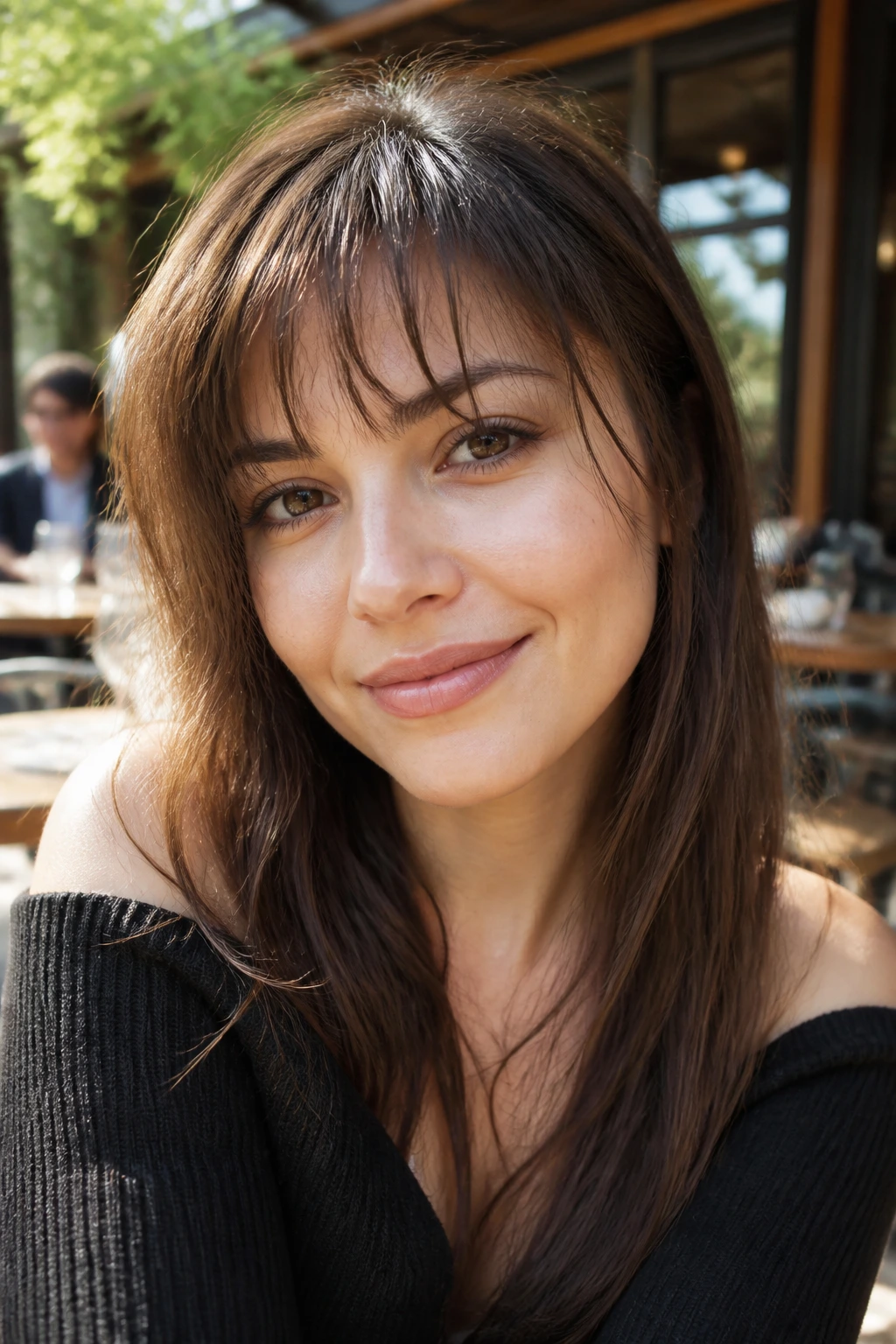 Close-up of Razor-Cut Piecey Fringe on a real woman in a sunlit cafe setting