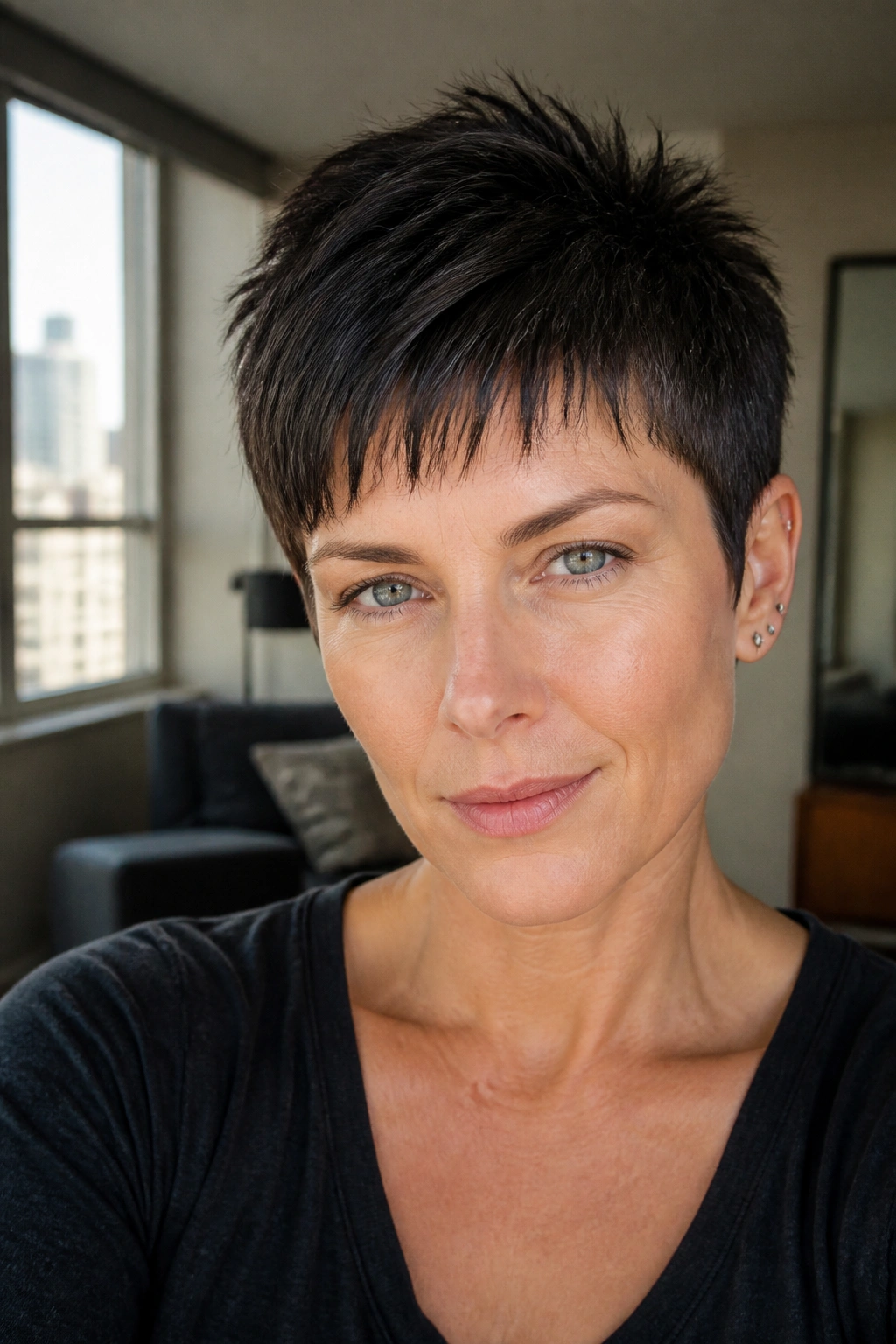 Portrait of a real person with razor-edged pixie haircut showing feathered ends