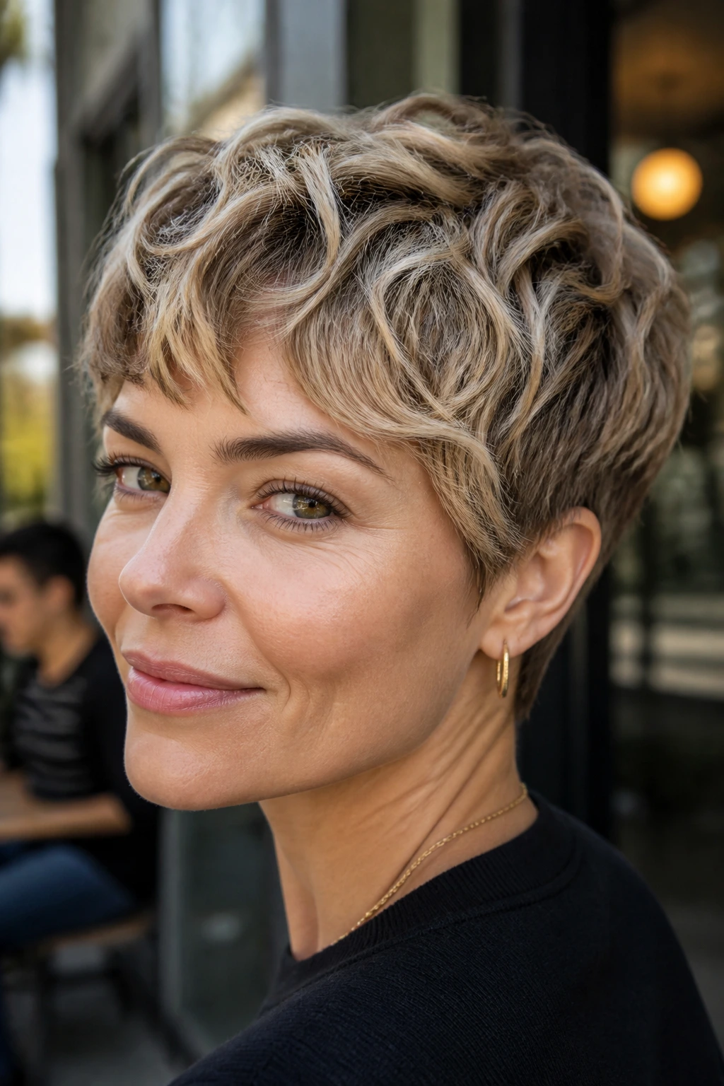 Close-up of a real woman with razor-wave pixie hairstyle