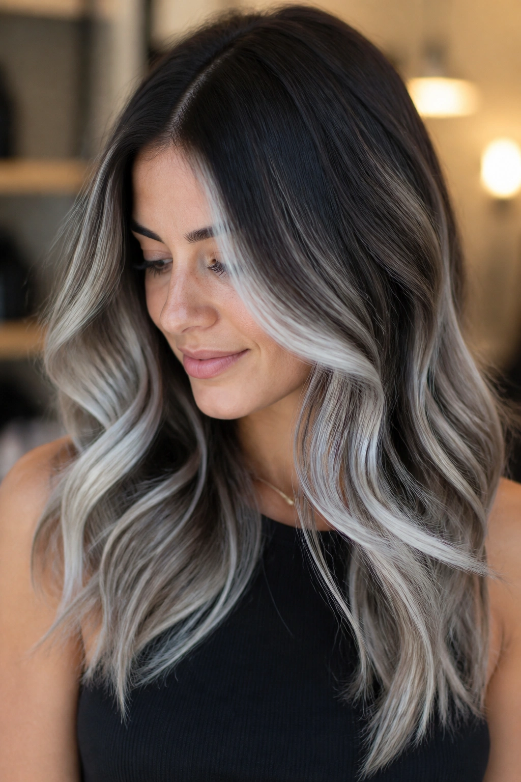 Dark brunette hair with rooty white balayage on a real person