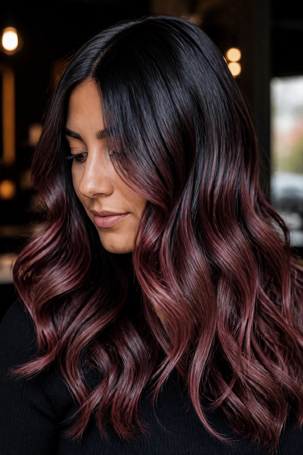 Real woman with deep rose gold gloss on near-black hair