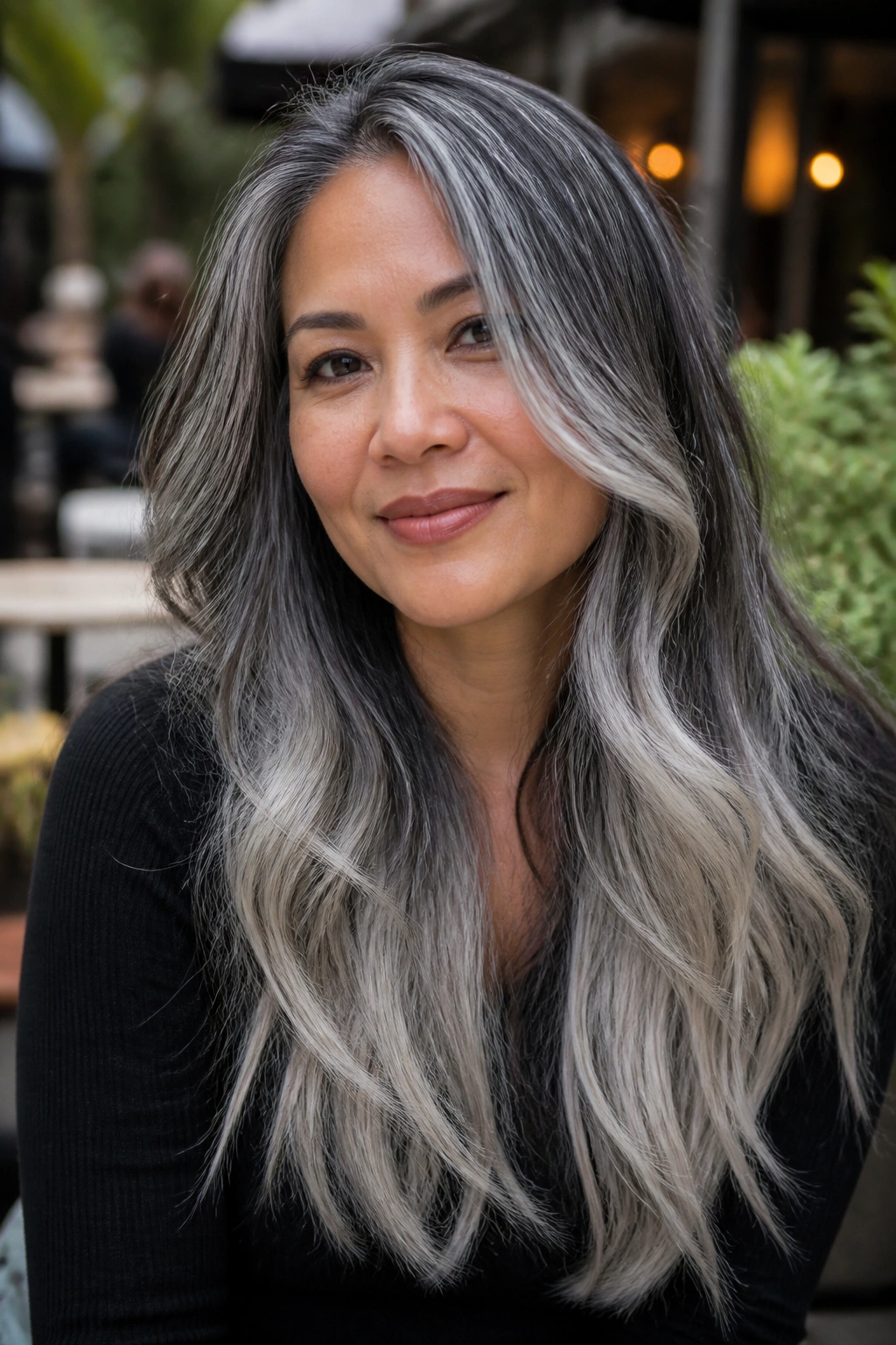 Close-up of real woman with salt-and-pepper silver blend on long hair
