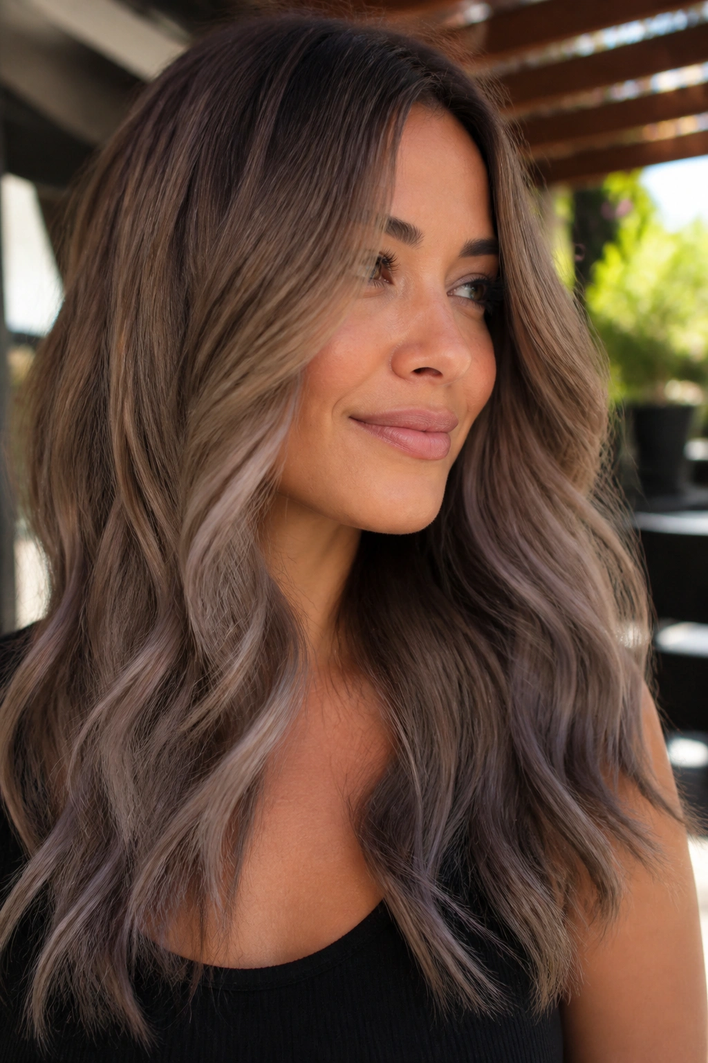 Close-up sandy brown to smoke taupe ombre on long hair