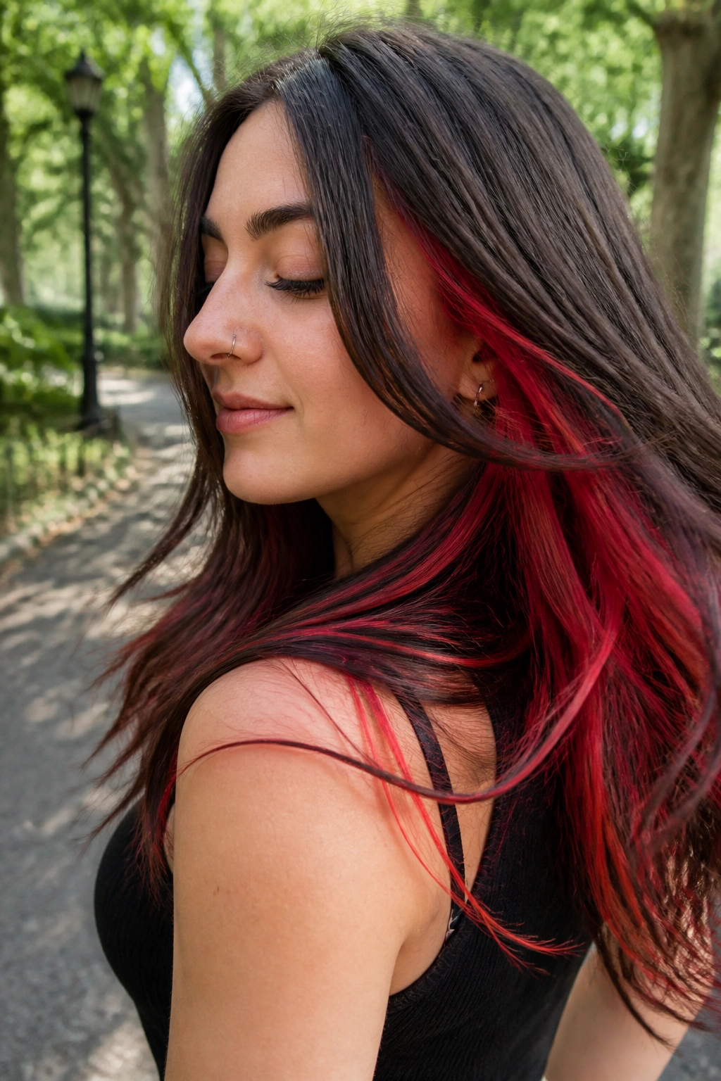 Brown hair with scarlet peekaboo underlayers visible as head turns